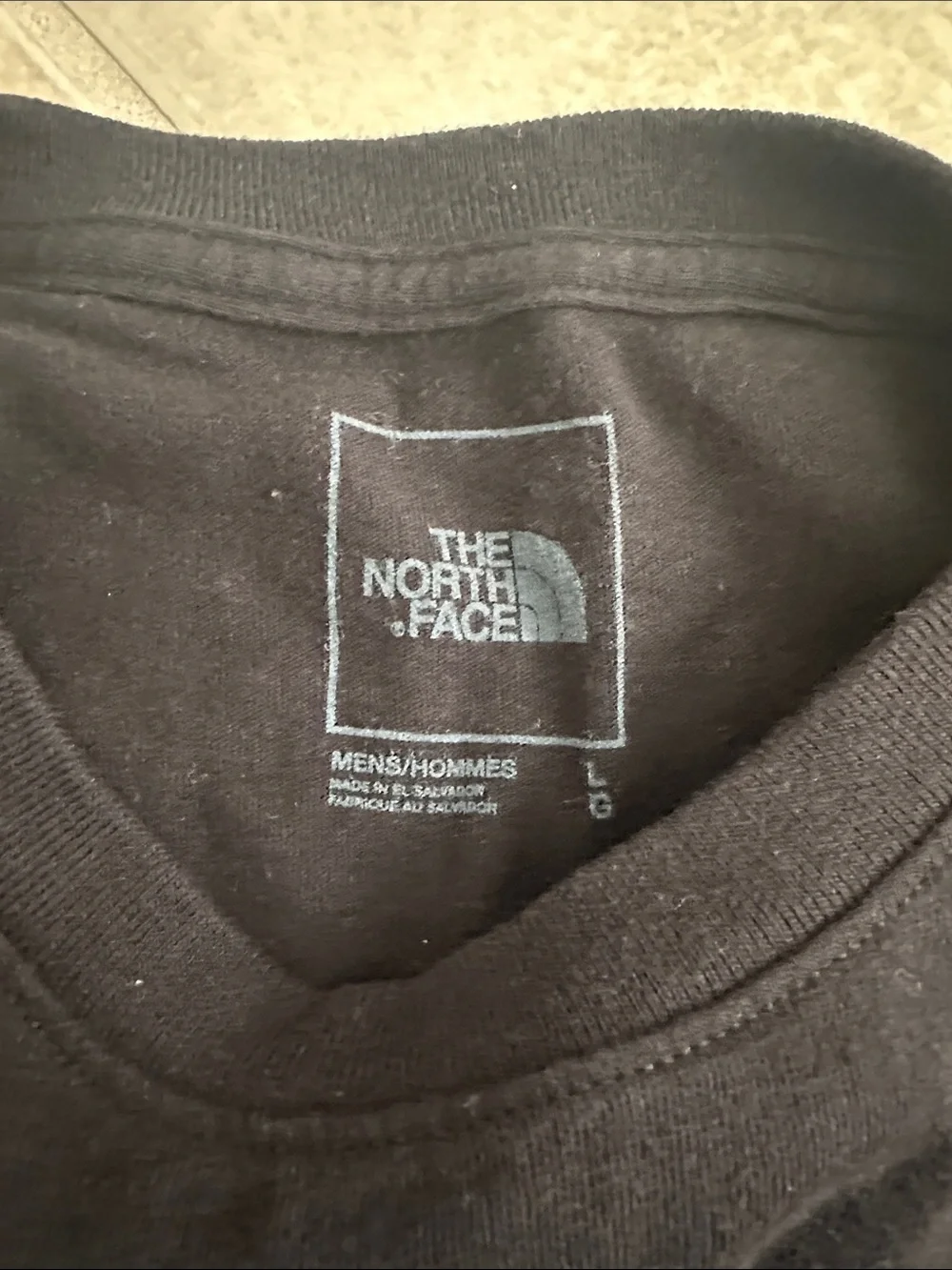 The North Face Black Short-Sleeve Tee with Green Logo Pocket